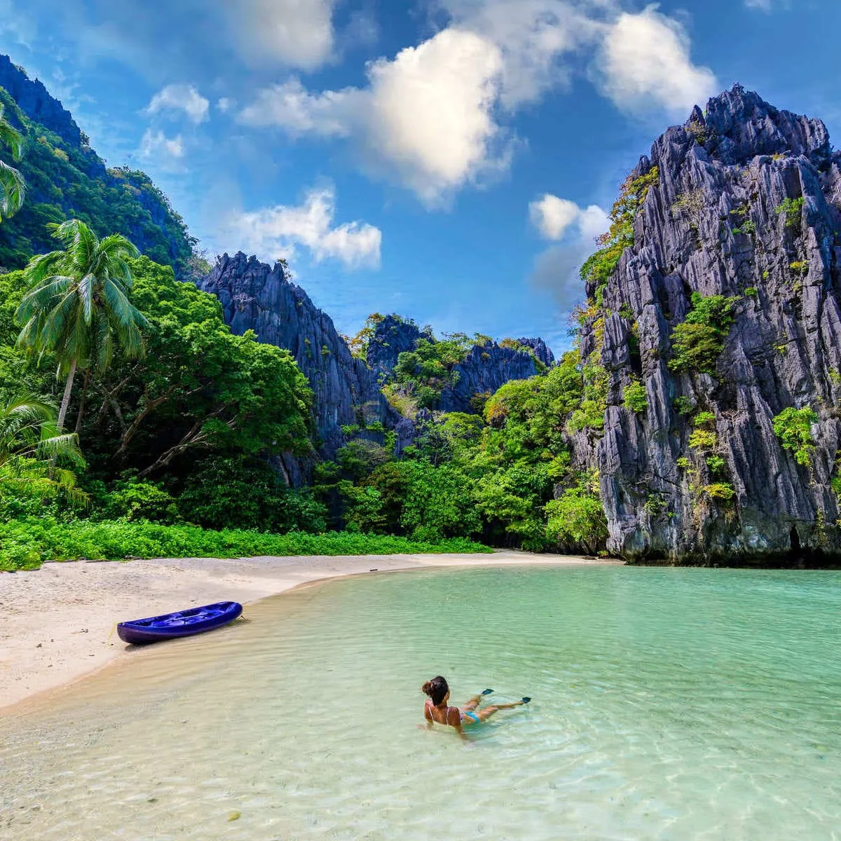 Young Woman Swimming On A Beach In Palawan, Philippines, Southeast Asia