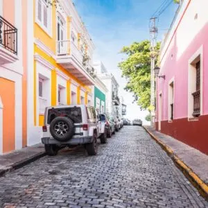 Cobblestone Alley Lined With Colorful Houses In Old San Juan, Puerto Rico