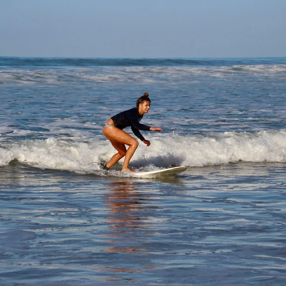 Female Surfer In Santa Teresa, Costa Rica, Central America