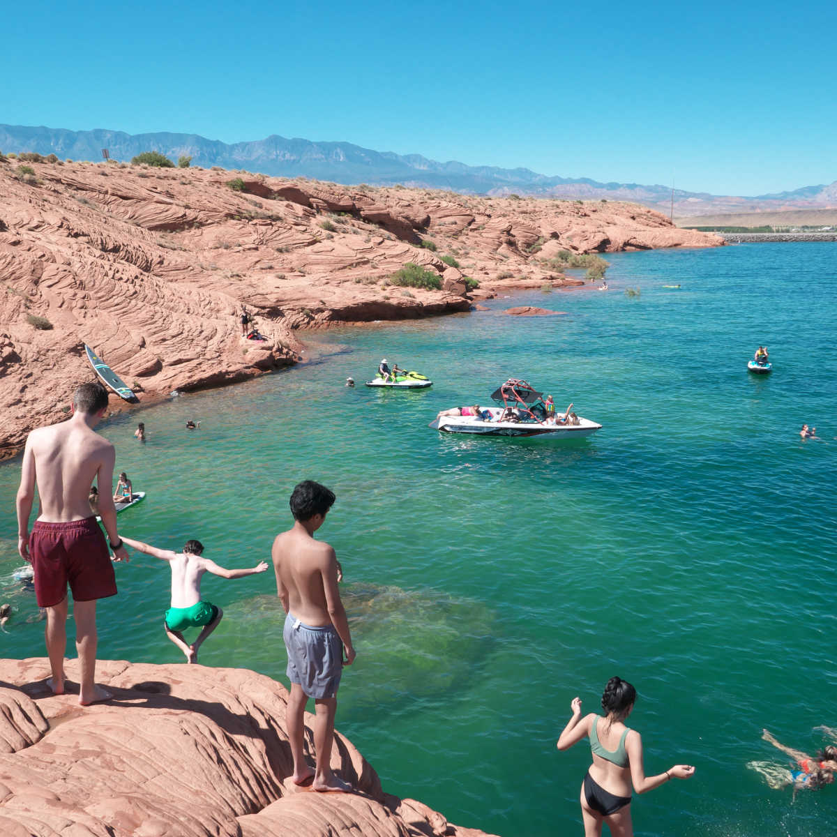 People-jumping-in-blue-water-of-Sand-Hollow-State-Park-in-Utah - Travel ...