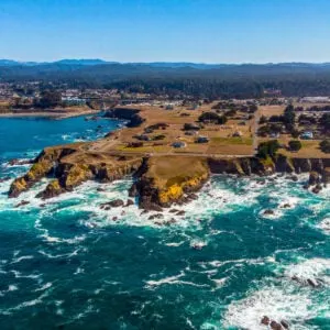 Teal waters and rugged cliffs off coast of Fort Bragg, California