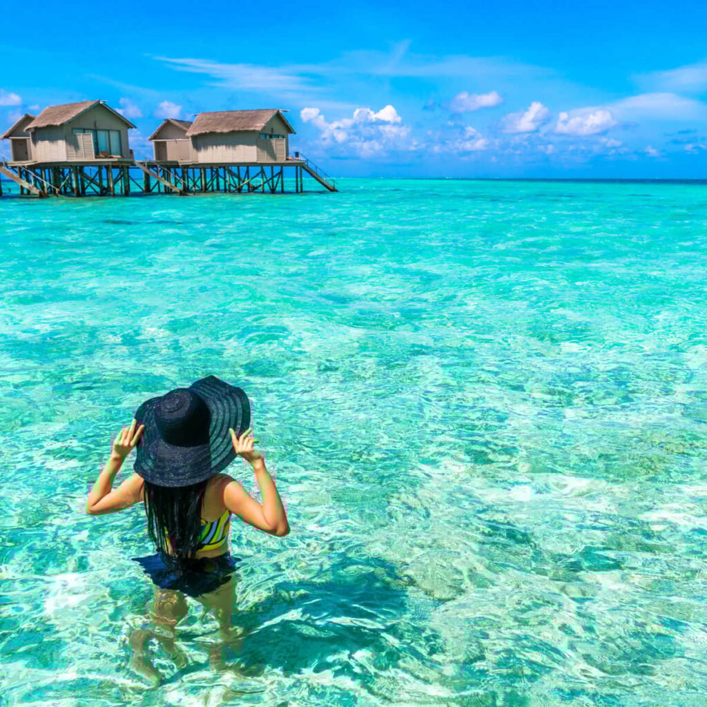 Woman going for swim in Maldives' pristine waters