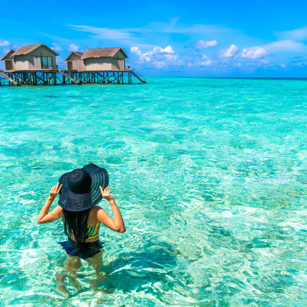 Woman going for swim in Maldives' pristine waters