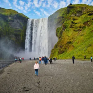 Tourists visiting Iceland's Skogafoss waterfall