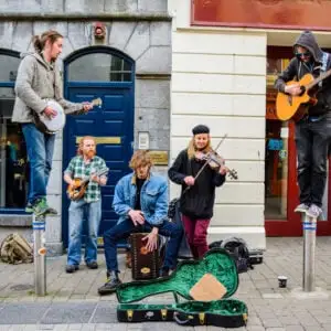 GALWAY, IRELAND. a local street musicians are playing gaelic music at galway streets