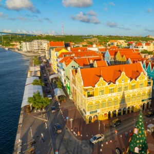 Penha building with Dutch style aerial view at sunset, on Handelskade Street in Punda, Willemstad, Curacao. Historic Willemstad is a UNESCO World Heritage Site.