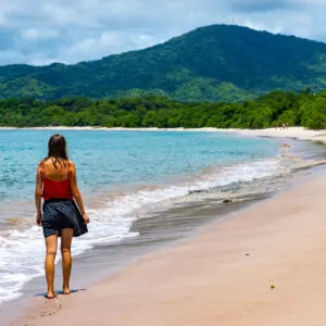 Young woman taking walk on beach in Costa Rica