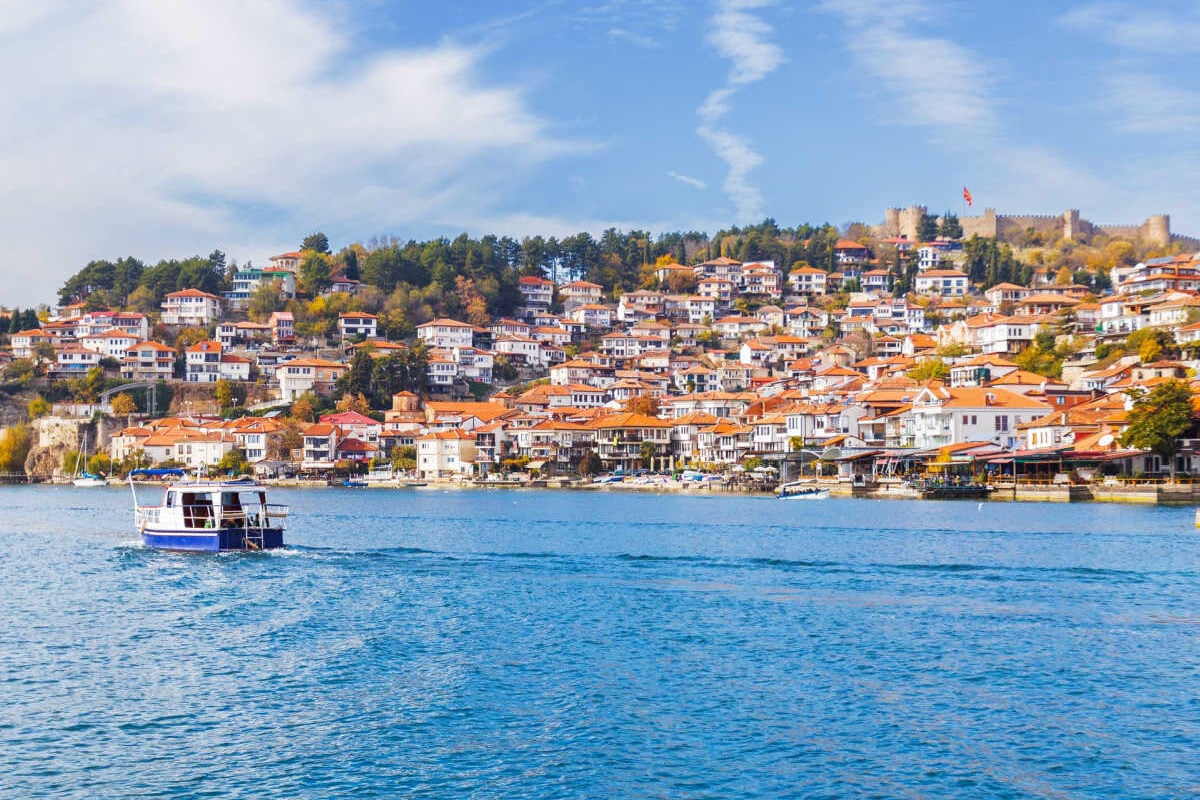 Boats riding by townscape of Lake Ohrid, North Macedonia