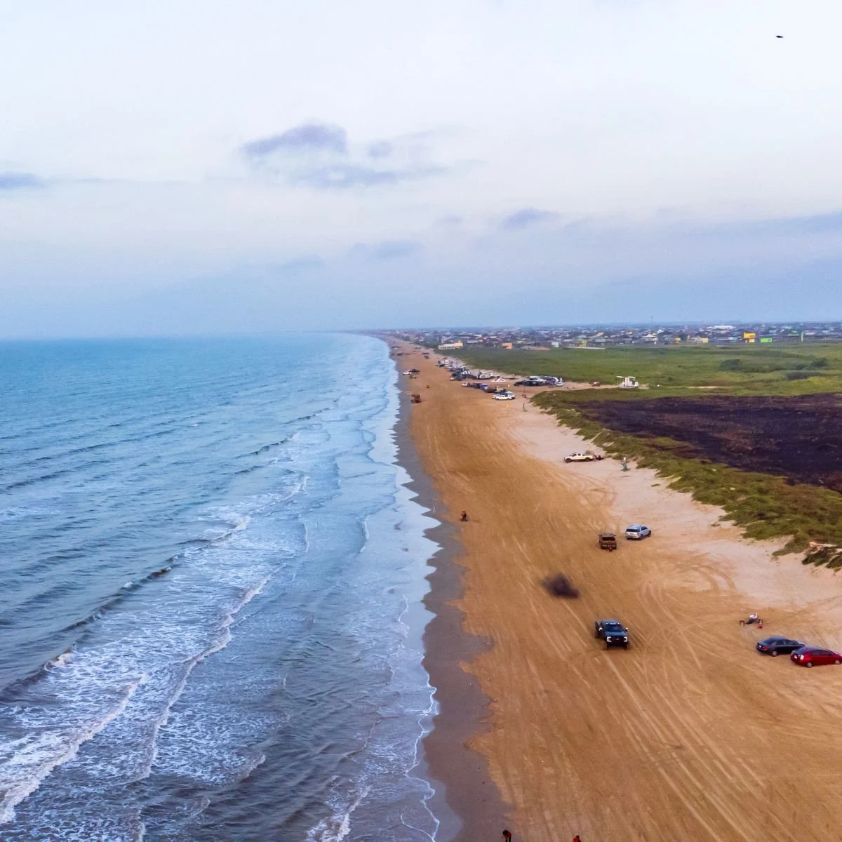 Cars driving on beach - Crystal Beach, Texas