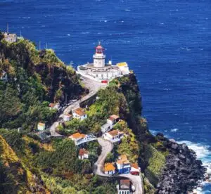 Dramatic view down to lighthouse on Ponta do Arnel, Nordeste, Sao Miguel Island, Azores, Portugal. Lighthouse Arnel near Nordeste on Sao Miguel Island, Azores, Portugal.