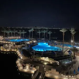 Night view of pools, mountains and starry sky at JW Marriott Desert Springs Resort & Spa