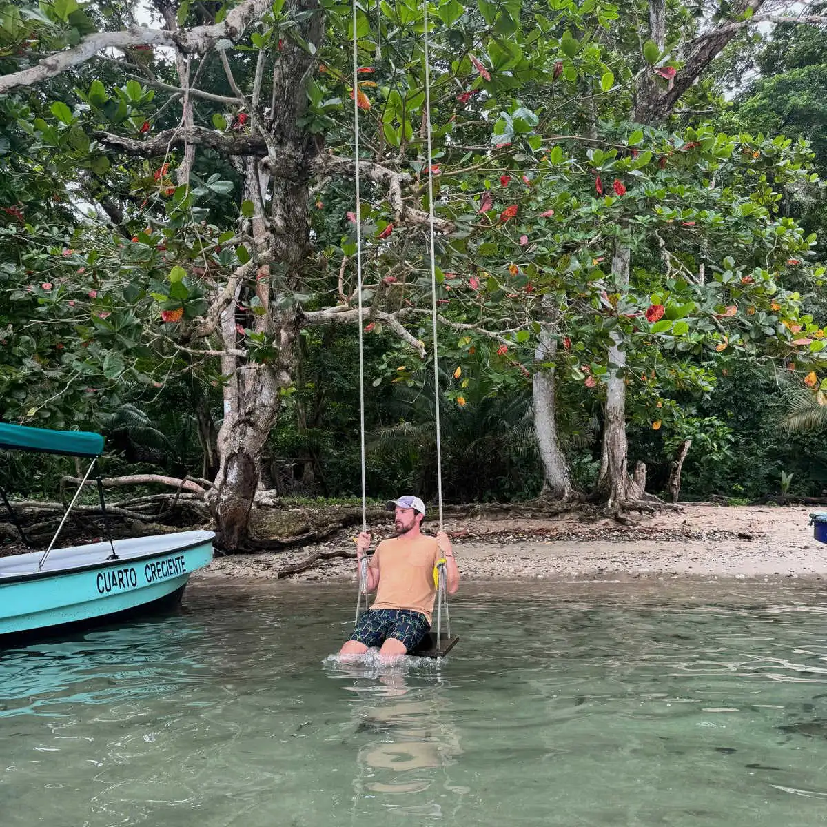 Swinging in water in Portobelo, Panama