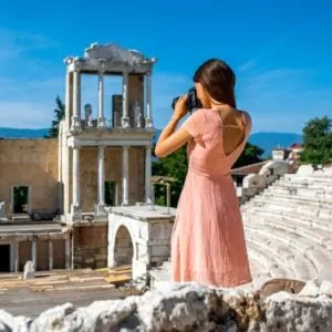 Young Woman Taking A Picture Of The Ancient Roman Theater In Plovdiv, Bulgaria