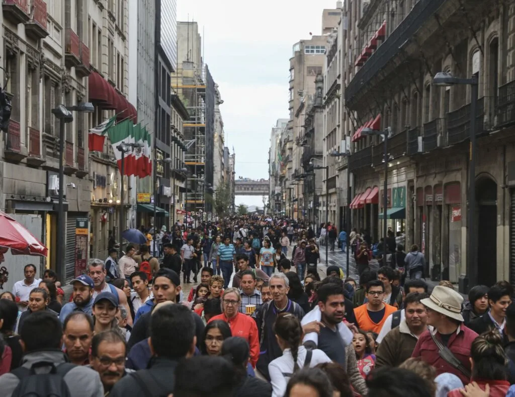  Pedestrians walk down the busy streets of the historical center of Mexico City.

