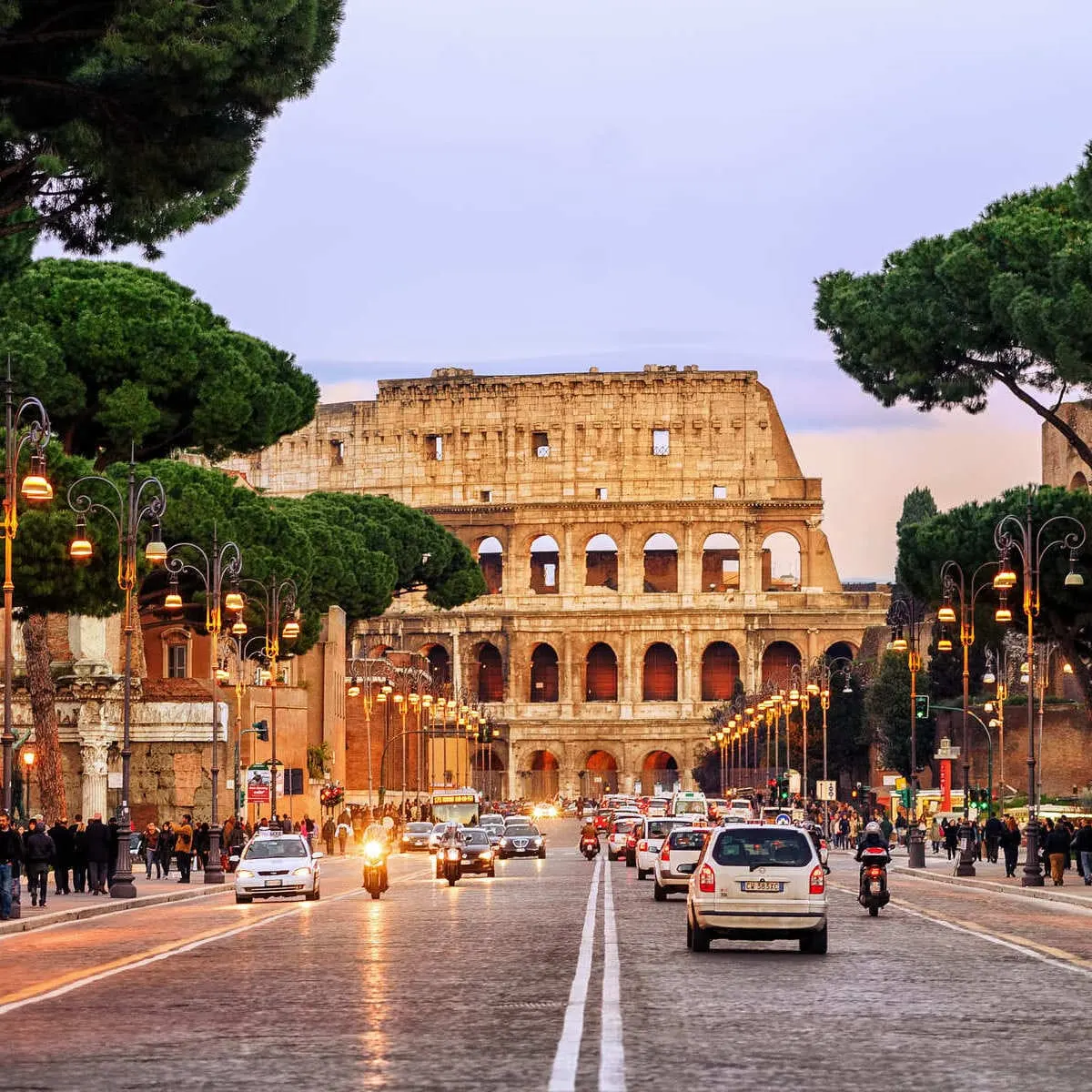 A Road Leading To The Colosseum In Rome, Italy