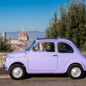 A Vintage Car Parked At A Viewpoint Overlooking The Duomo In Florence, Italy