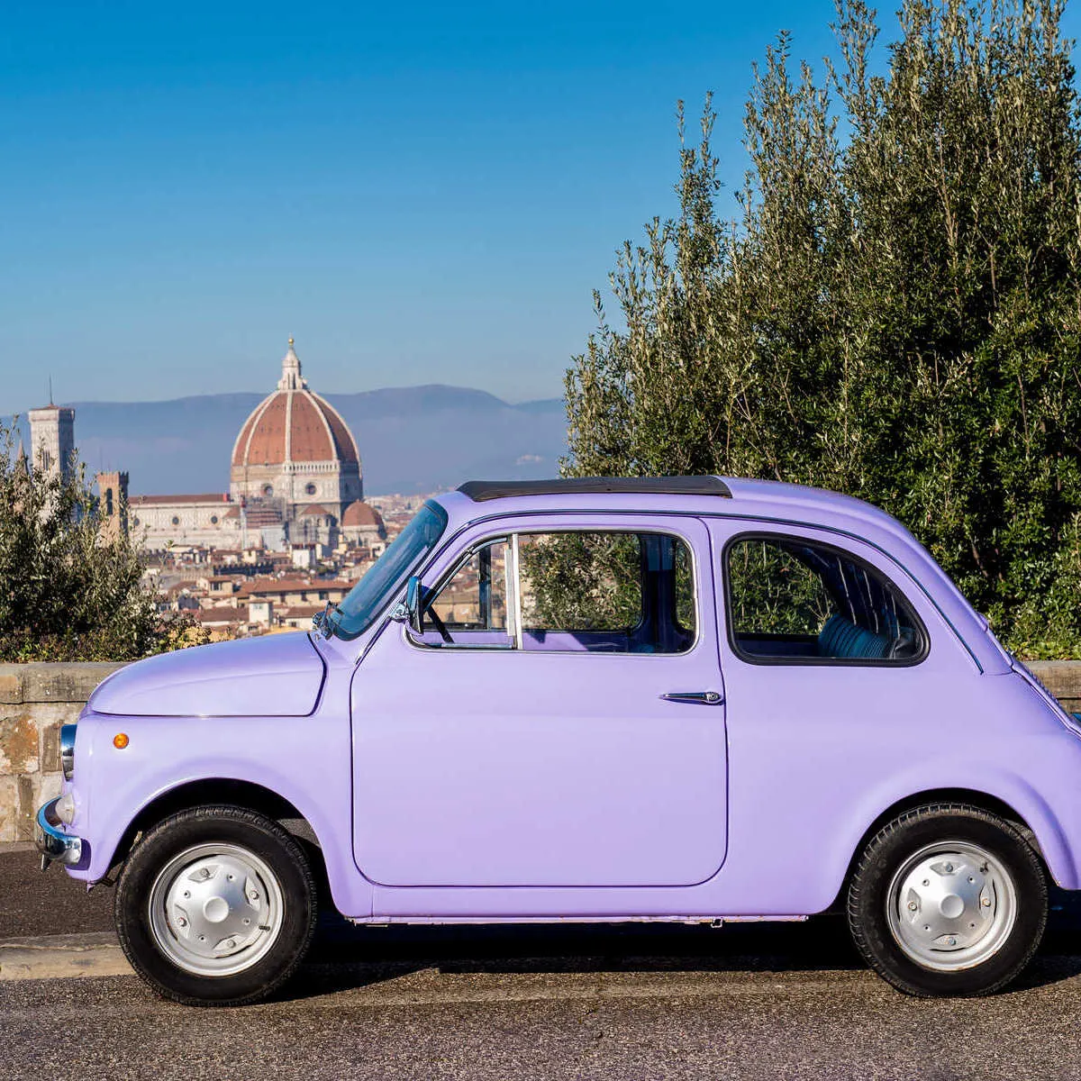 A Vintage Car Parked At A Viewpoint Overlooking The Duomo In Florence, Italy