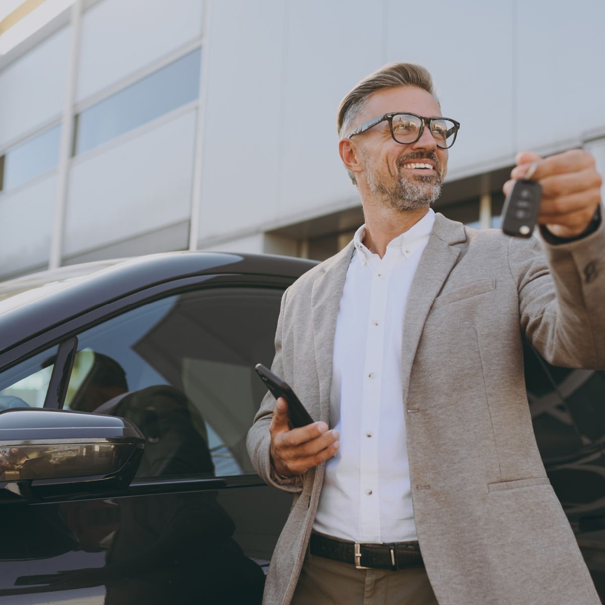 Man holding rental car keys