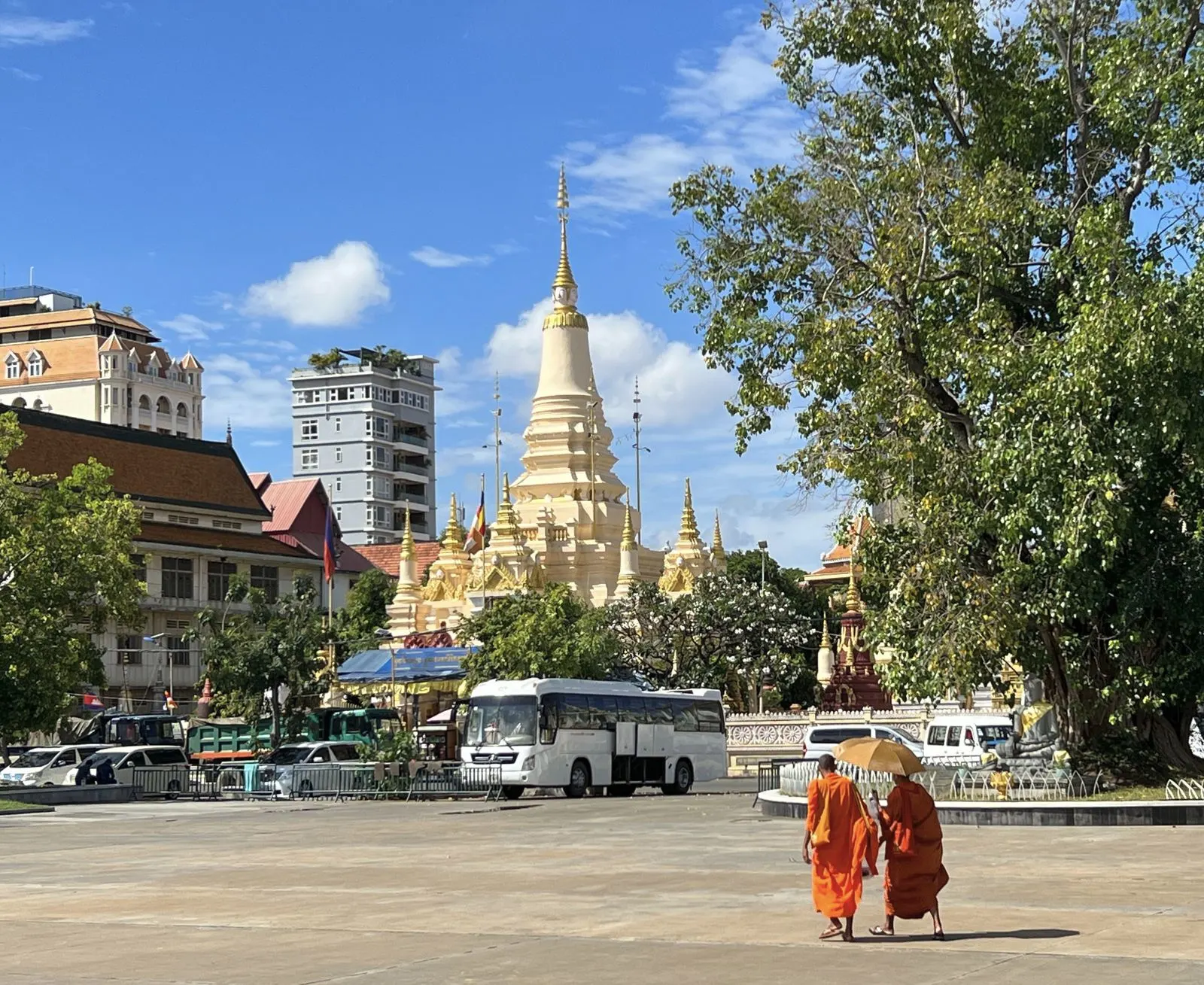 Monks walk at Wat Botum Park in Phnom Penh, Cambodia
