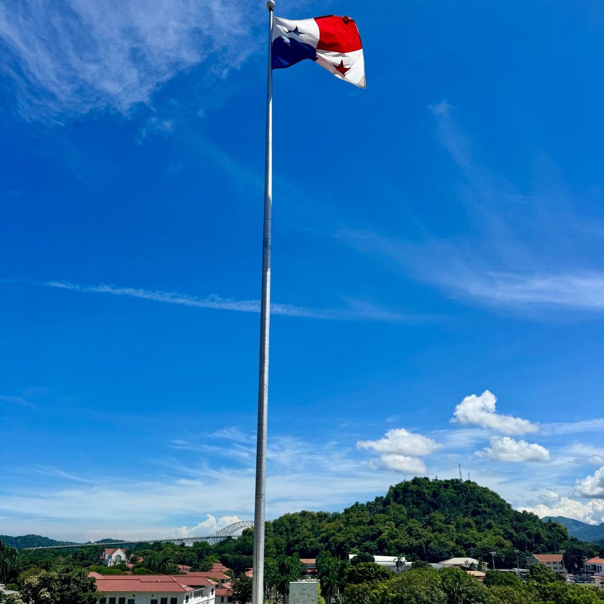 Panama flag flying near Panama Canal