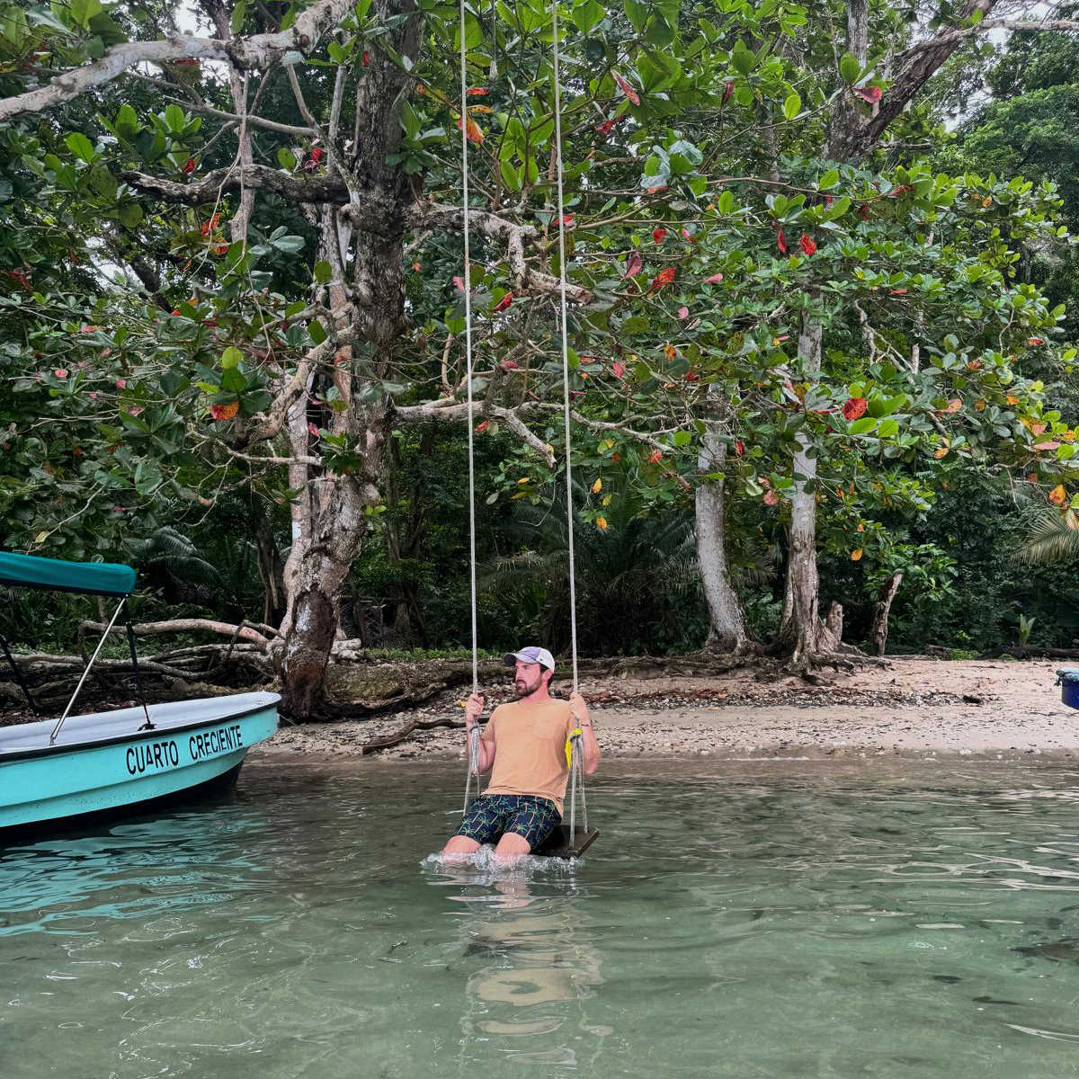 Swinging in water in Portobelo, Panama