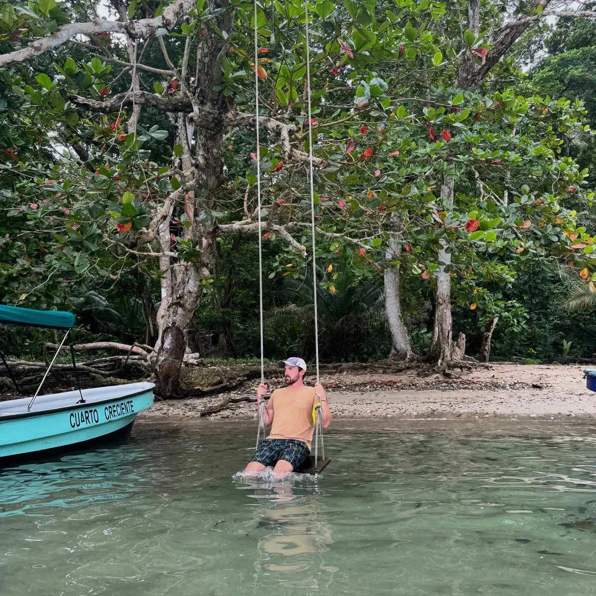 Swinging in water in Portobelo, Panama