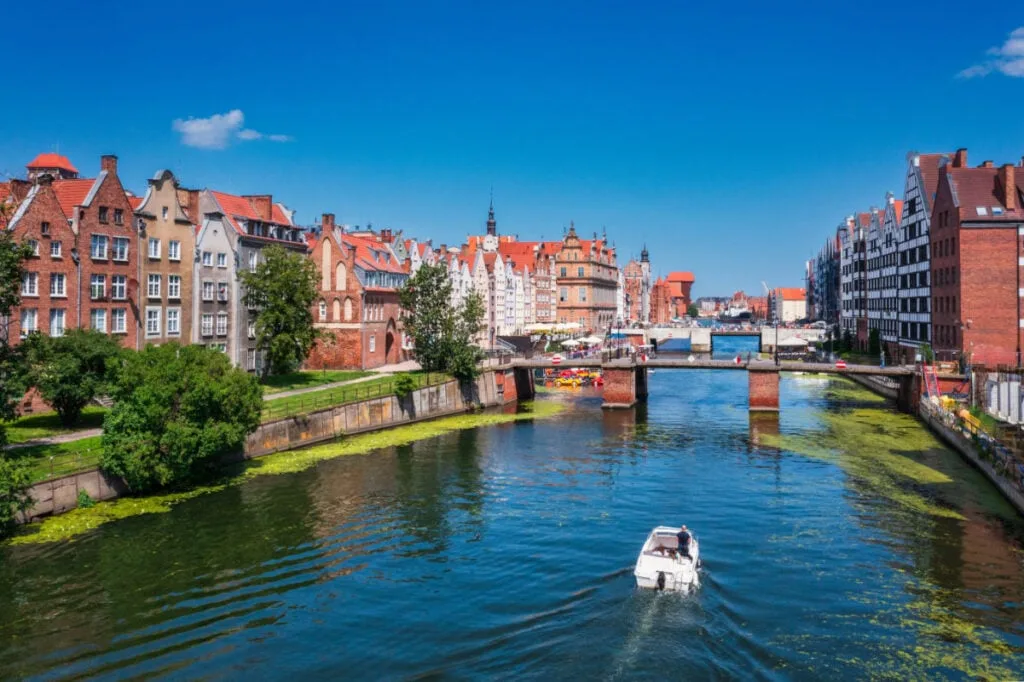 View of Gdansk canal with a boat on a summer day