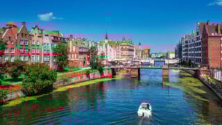View of Gdansk canal with a boat on a summer day