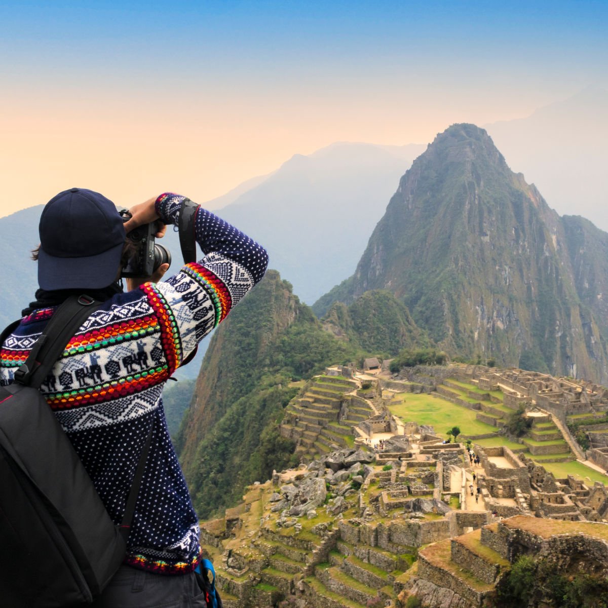 Tourist taking photo of Macchu Picchu