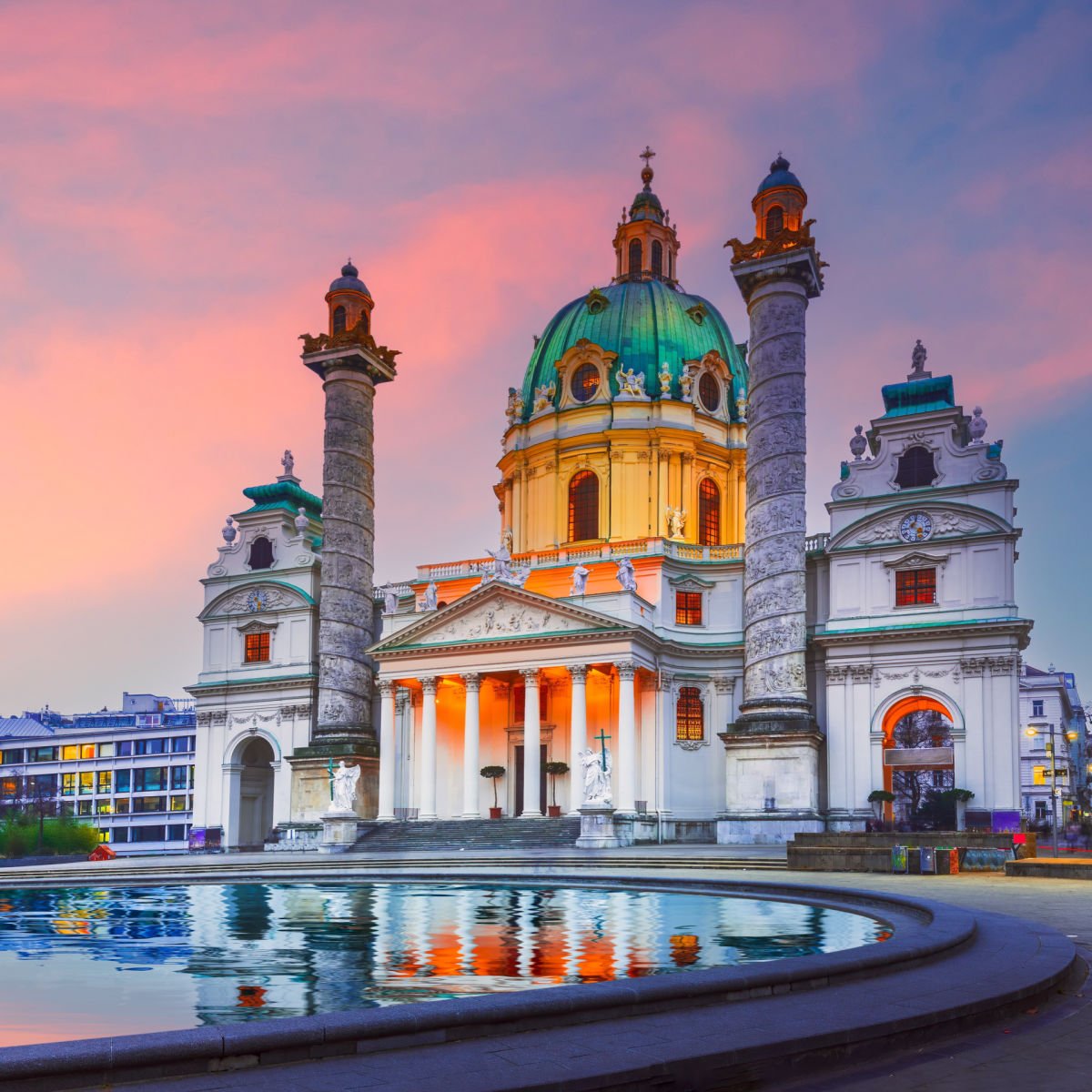 5 Surprising European Cities Surging In Popularity This Summer Vienna, Austria's Karlskirche is a Baroque church