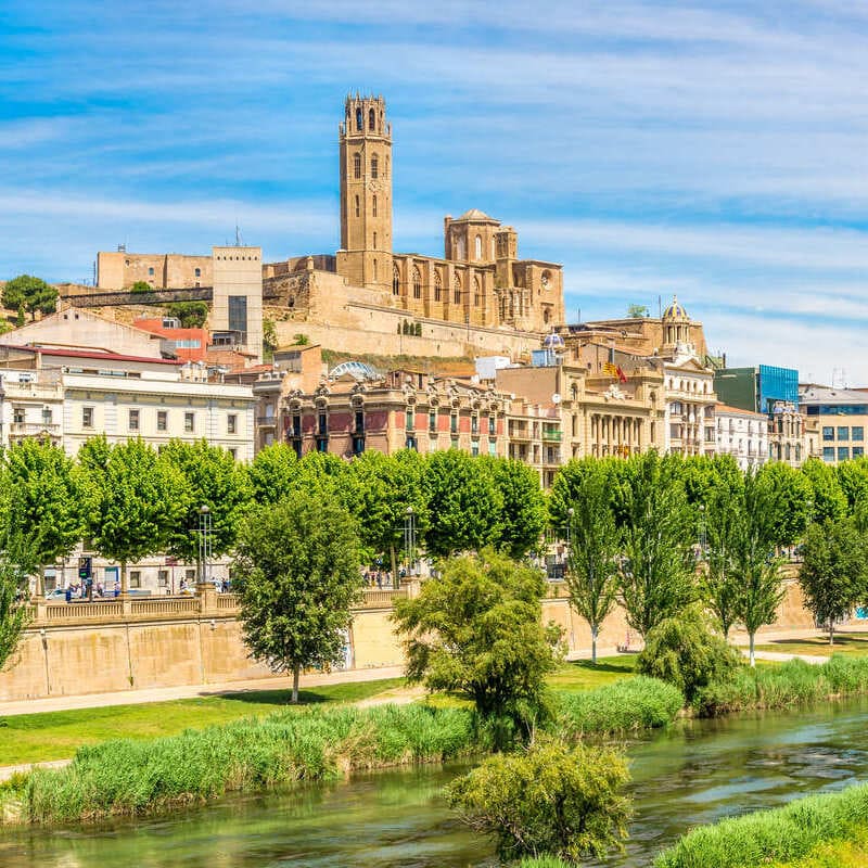 Forget Barcelona! These 4 Authentic Towns Less Than 2 Hours Away Are Less Crowded View Of The Old Cathedral In Lleida, Spain