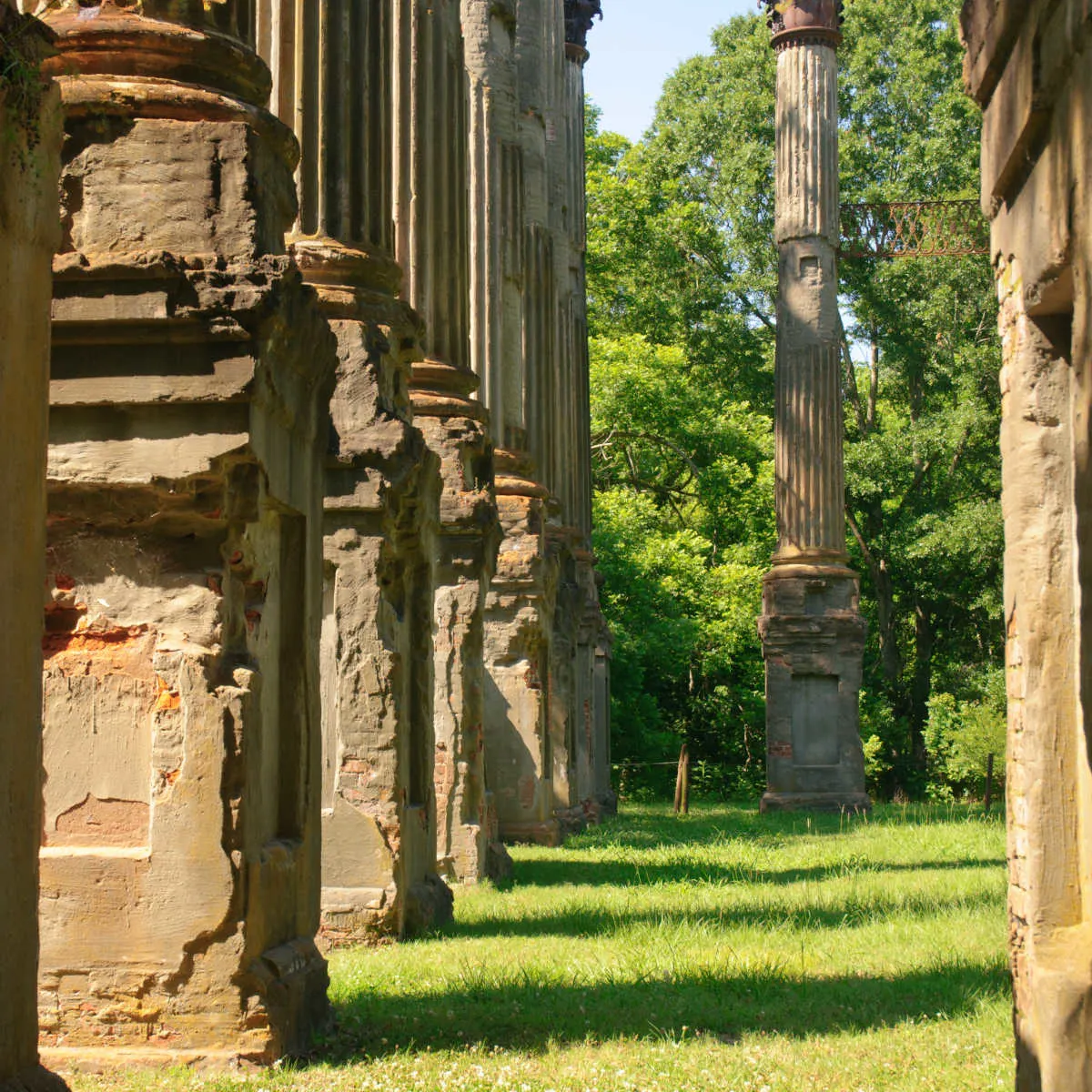 This Affordable Riverside Town Oozes Southern Charm & European Vibes Windsor Ruin pillars in Port Gibsons, MS