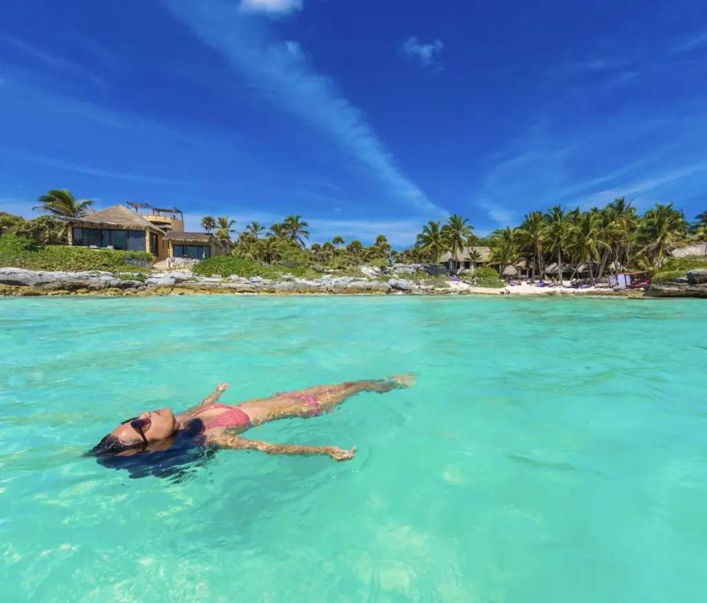Cancun & Riviera Maya Declared Safe For Swimming After Nationwide Inspection Of 2300 Beaches Woman-swimming-in-water-face-exposed-to-sun.jpg