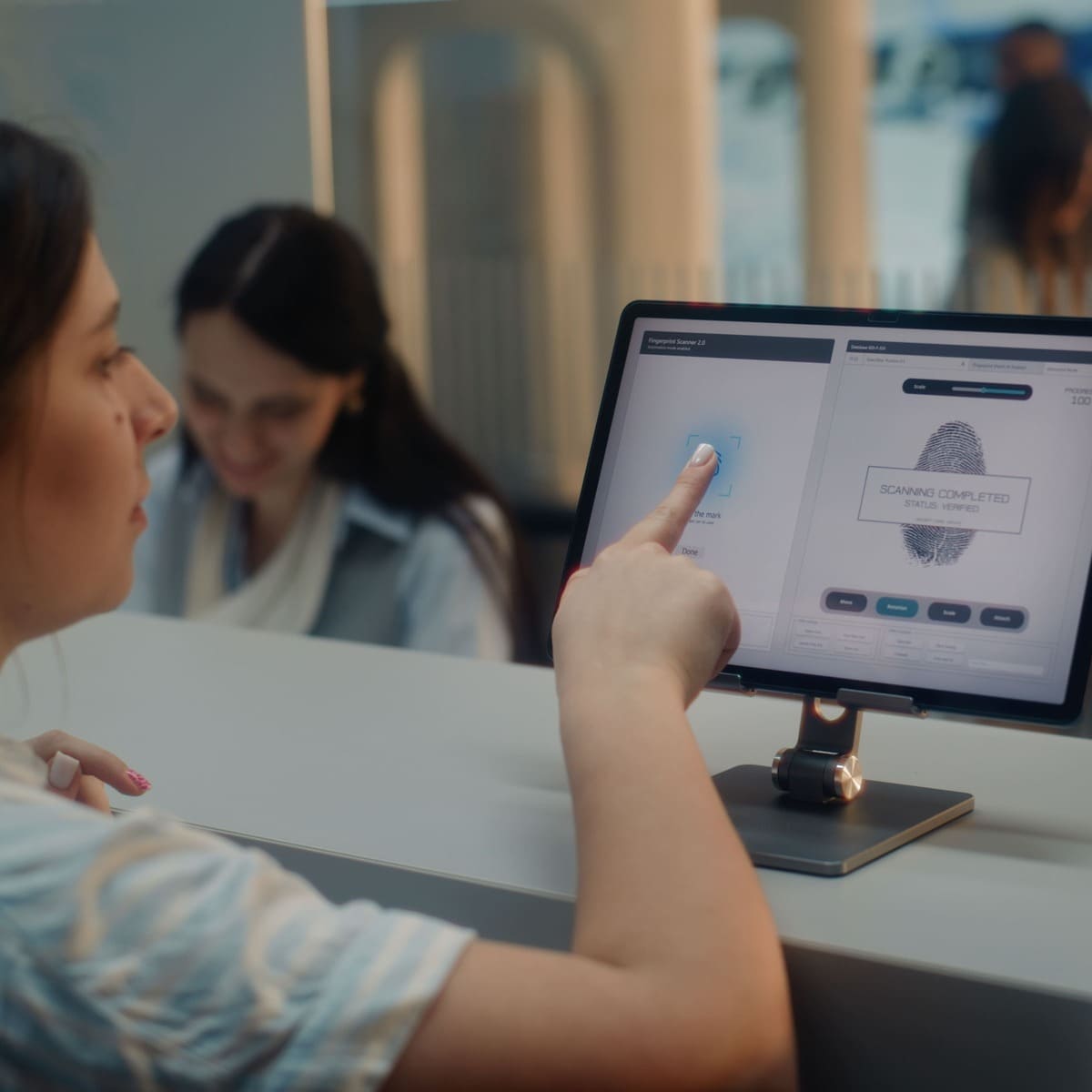 A Passenger Giving Their Fingerprints At An Airport