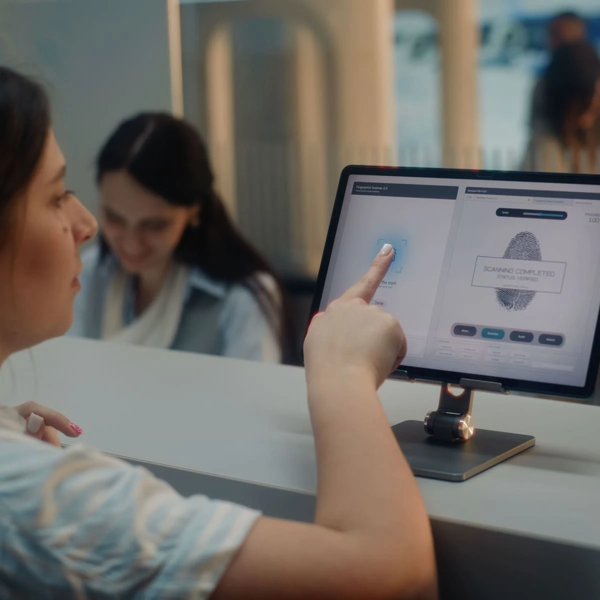 A Passenger Giving Their Fingerprints At An Airport