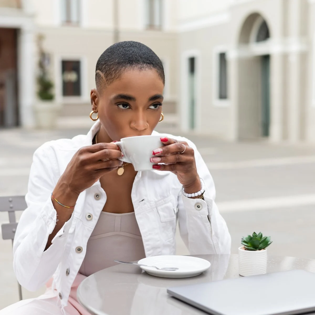Digital nomad sipping coffee at European cafe