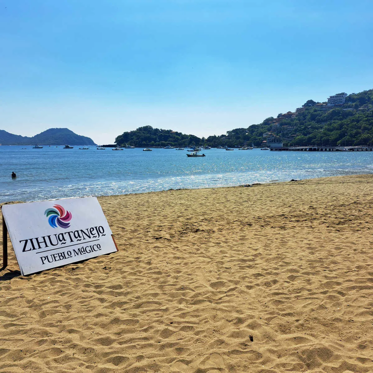 5 Underrated Destinations In Mexico For A Crowd-Free Getaway Golden beach in the Pueblo Magico of Zihuatanejo, MX