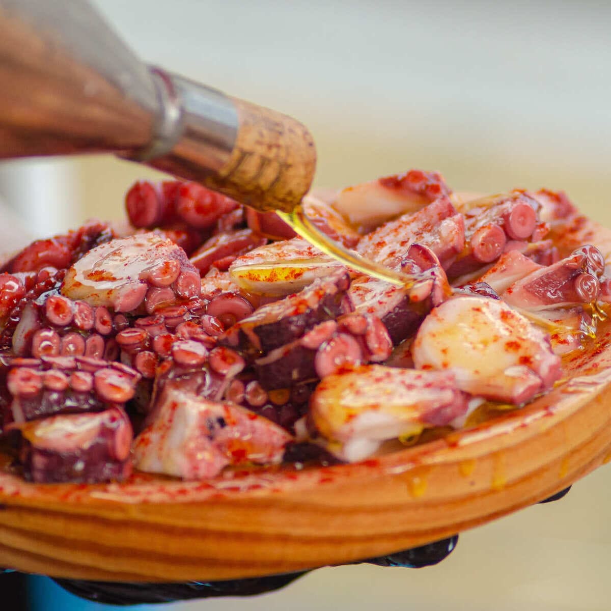 Why This Lesser-Known Medieval City In Spain Is Skyrocketing In Popularity Grilled Octopus Served With Olive Oil In Pontevedra, Spain