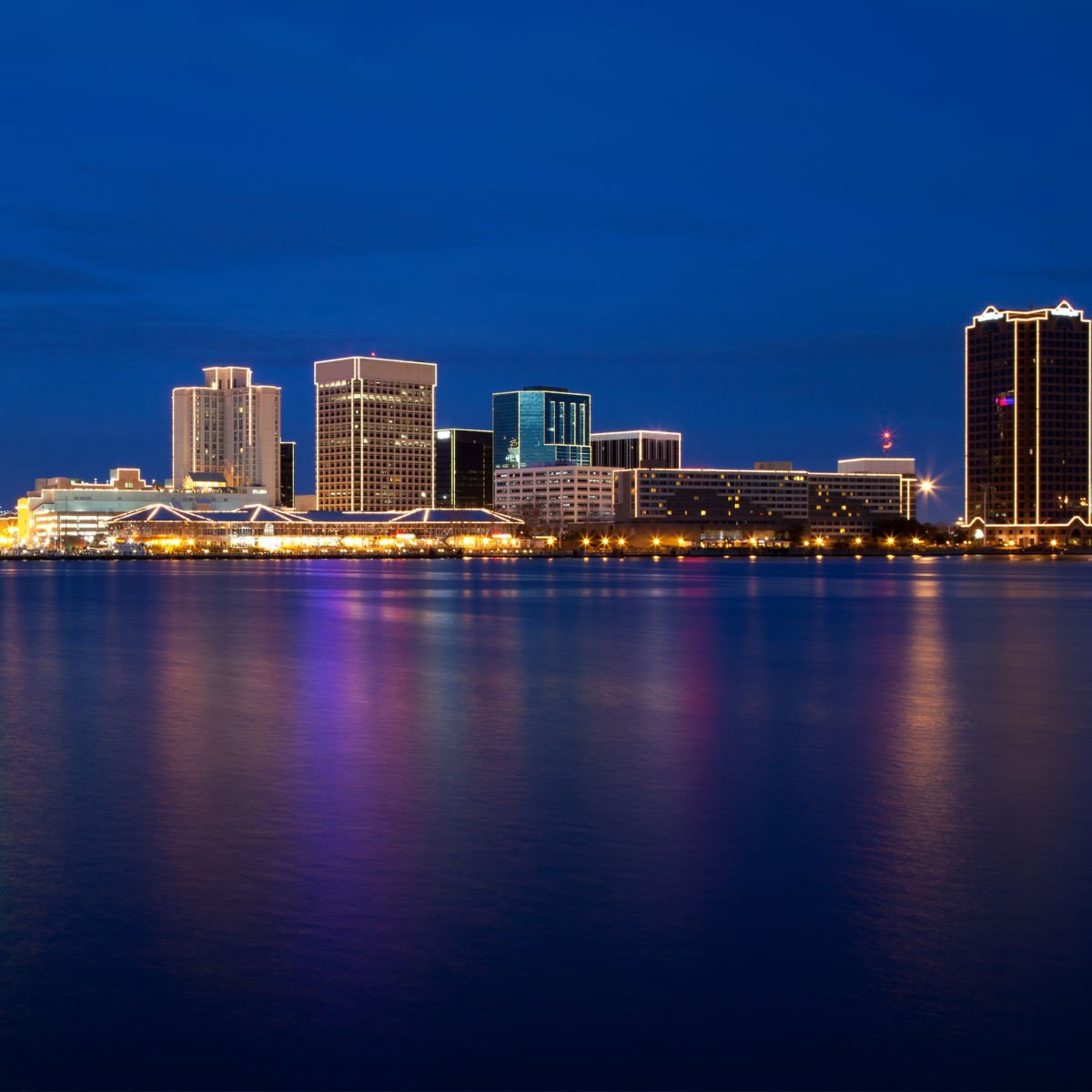 This Surprising U.S. State Sees Record Number Of Amtrak Passengers Norfolk, VA skyline at night