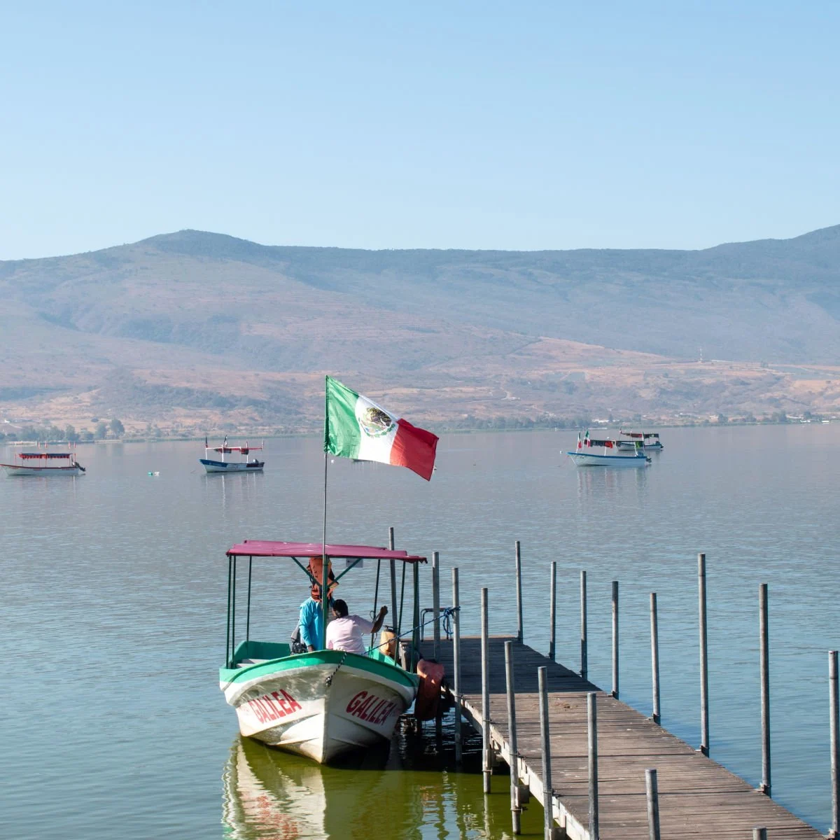 US State Department Issues New Travel Advisory For Mexico Small boat bearing Mexico flag