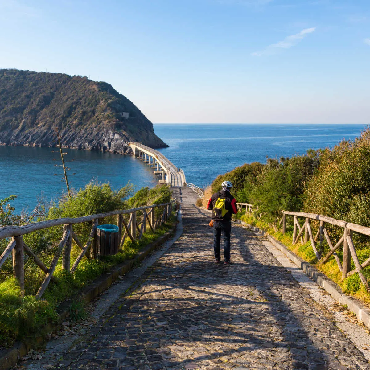 Tourist In Procida Crossing The Bridge To Vivara Islet, Italy