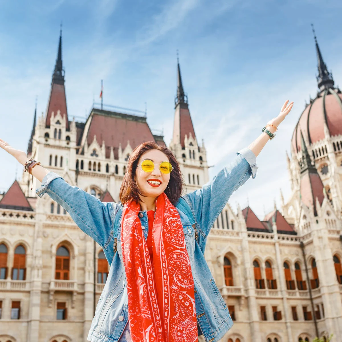 American Airlines Launching 5 New Routes To Popular International Destinations Tourist posing at Parliament building in Budapest