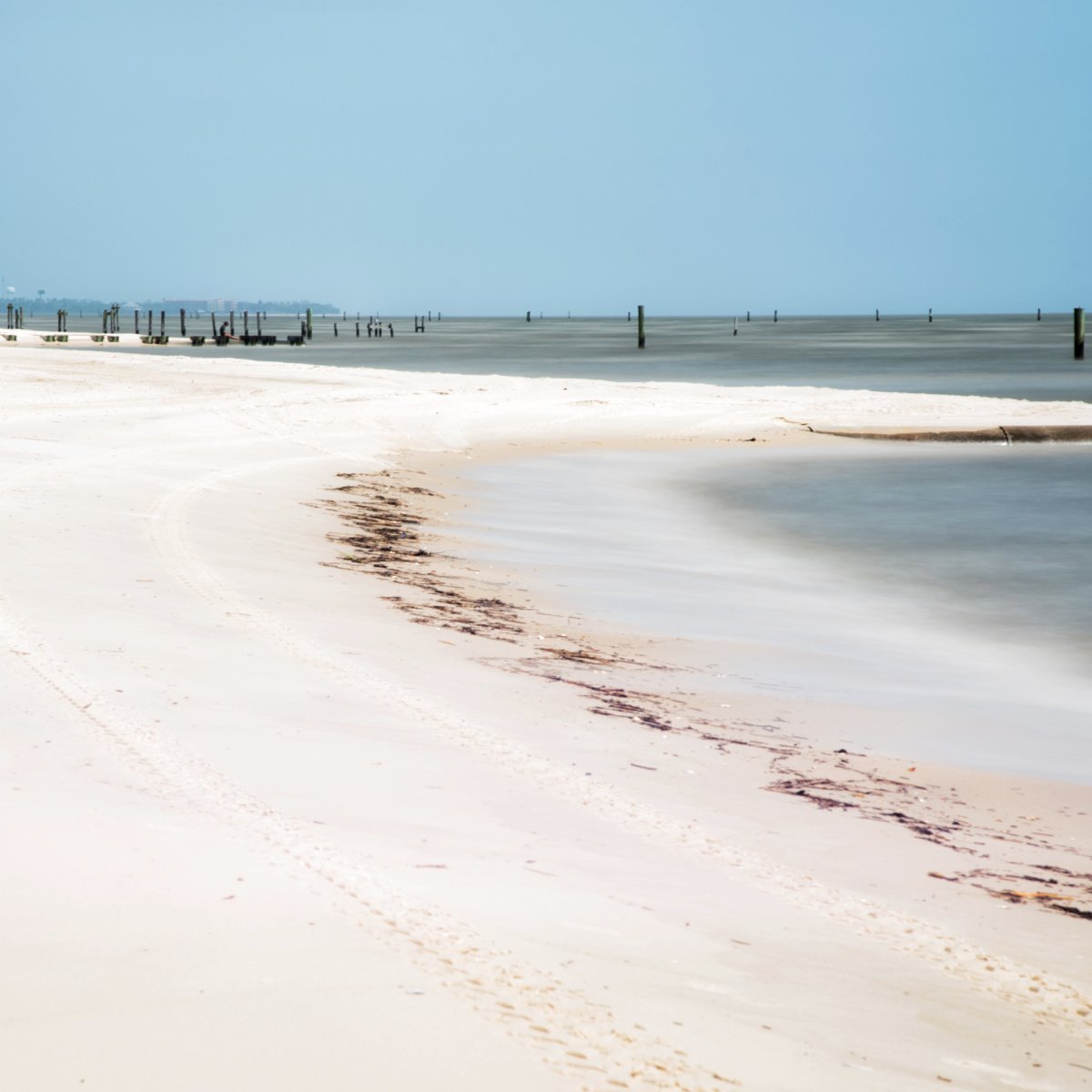 Discover 3 White-Sand Beach Towns With No Crowds In The South's Trendiest State White-sand beach in Waveland, MS