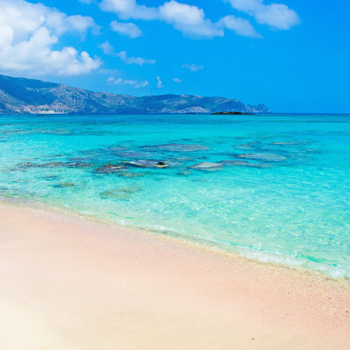 Beach with turquoise waters in Elounda, Greece