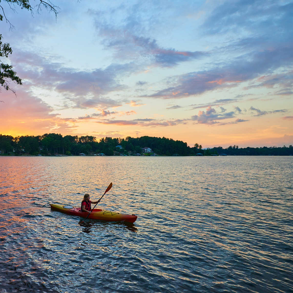 Kayaker on Lake Keowee at sunset