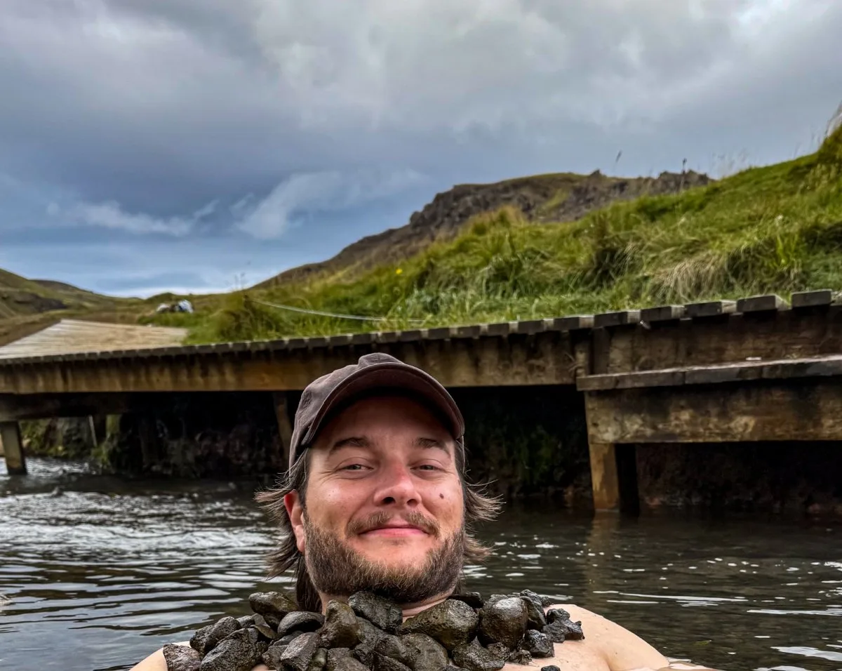 Man in Reykjadalur Hot Spring Thermal River in Iceland
