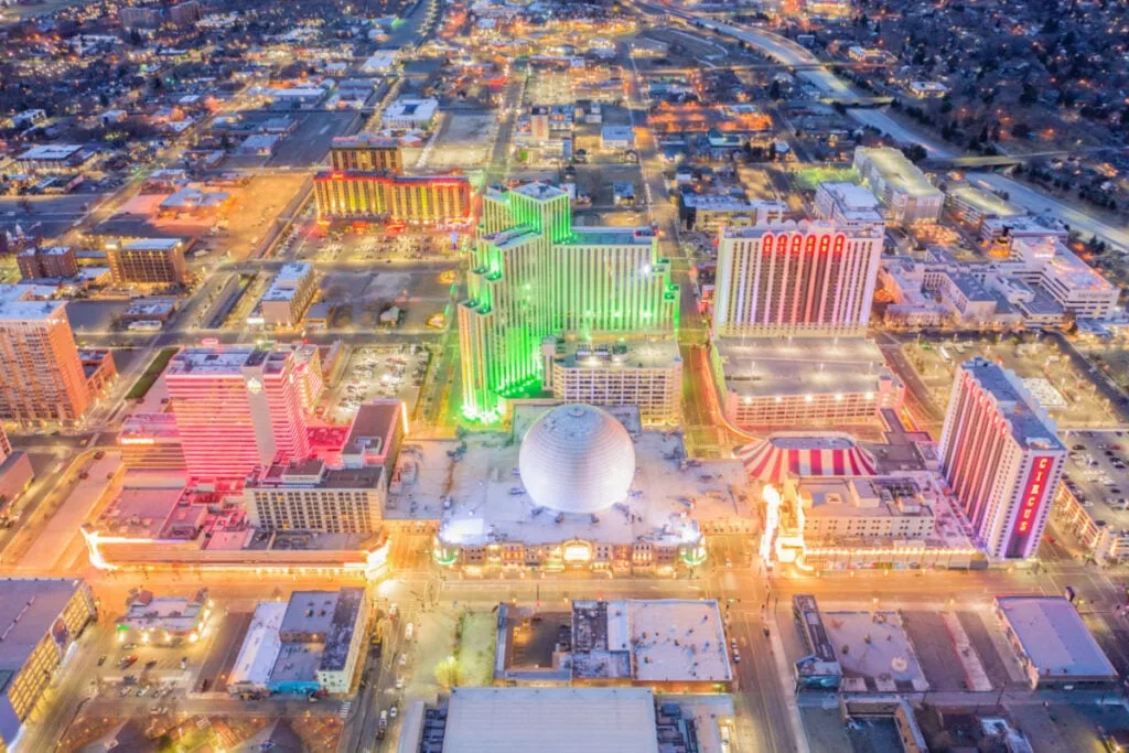 Aerial view of neon-lit Reno cityscape
