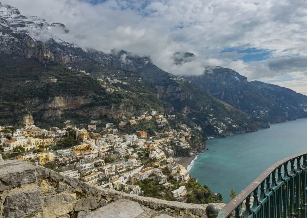 Positano on the Amalfi coast, Italy in wintertime with a mountain range in the background covered with snow