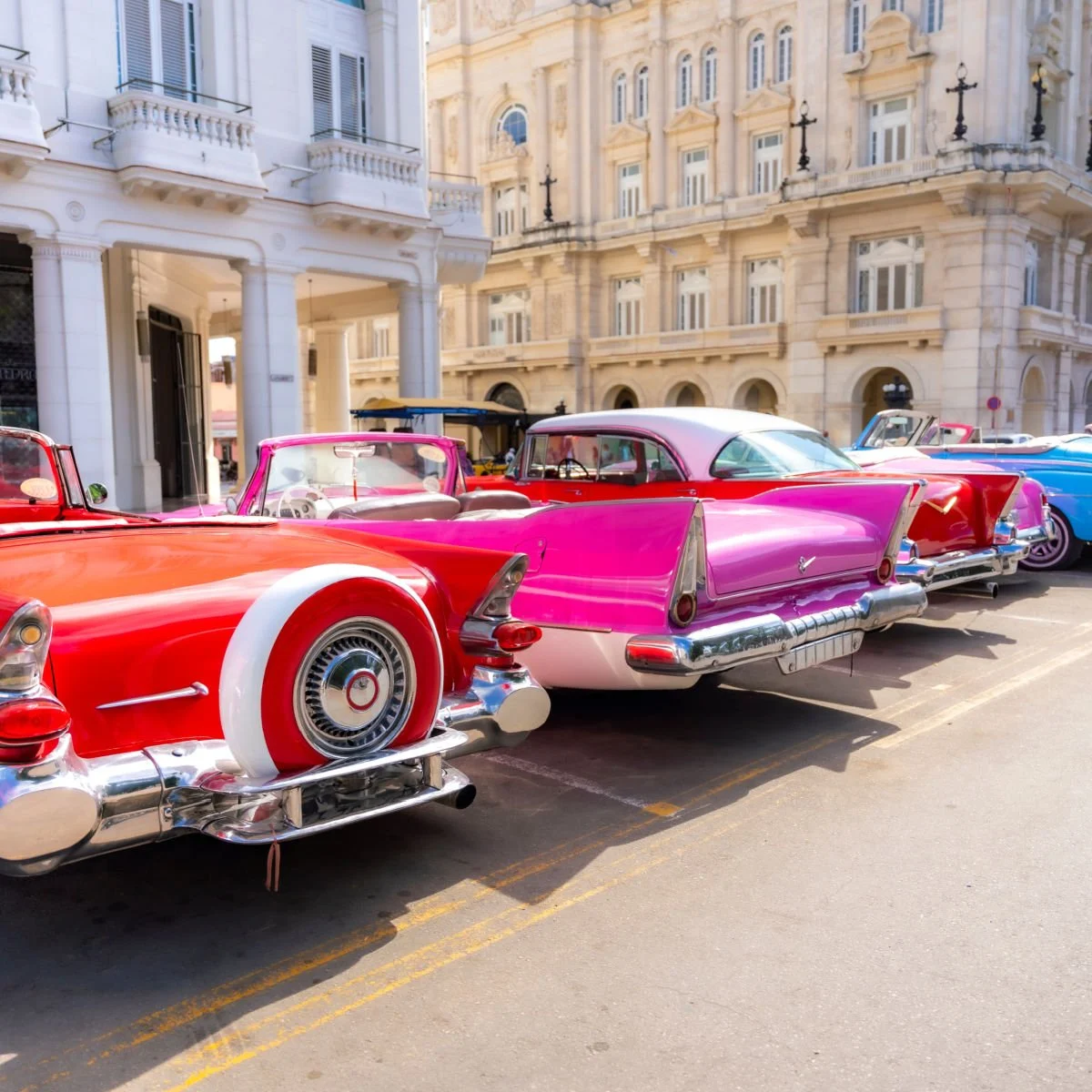 Row of colorful classic cars in Cuba