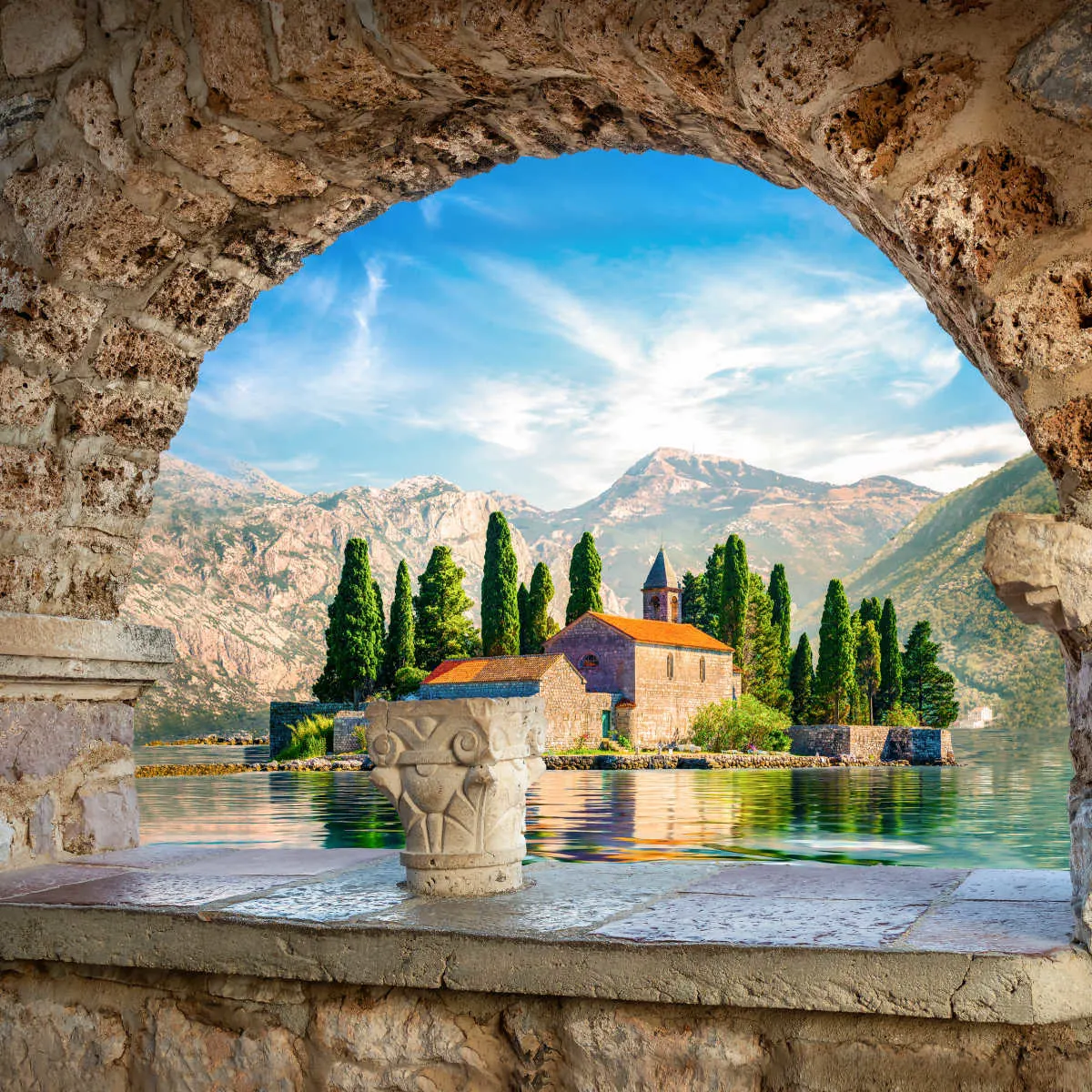 St. George island from Our Lady of the Rocks through archway -  Perast, Montenegro